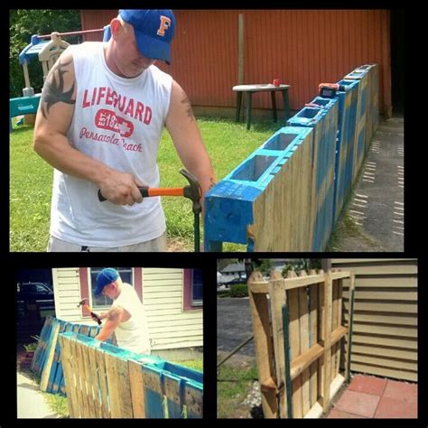 pallet and metal fence stake enclosure|building a pallet fence.